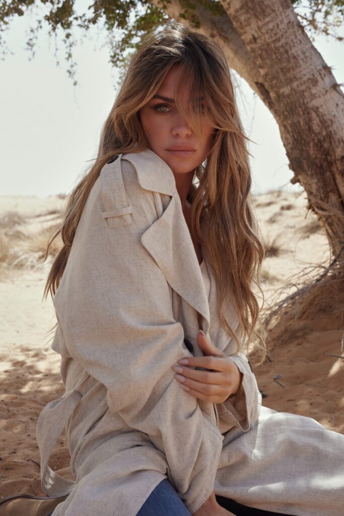 Fashion campaign image: model wearing a neutral linen trench coat (F&F)